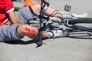 Man with wounds and possible injuries after a bicycle accident in Vancouver, WA.