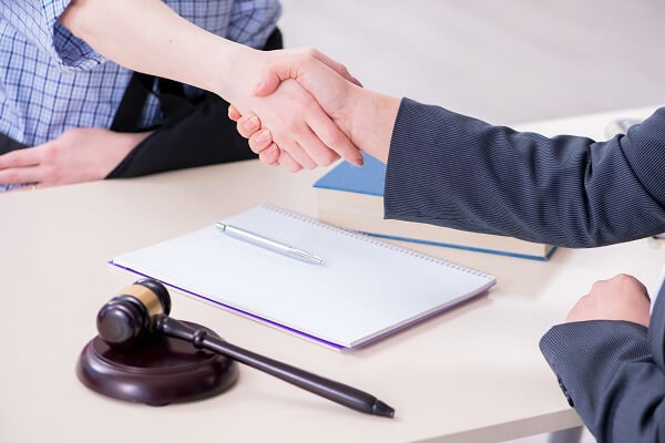 A client discussing with an attorney about who's at risk for a paraquat exposure.
