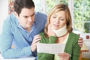 Injured woman showing her husband the personal injury claim form in Vancouver, WA.